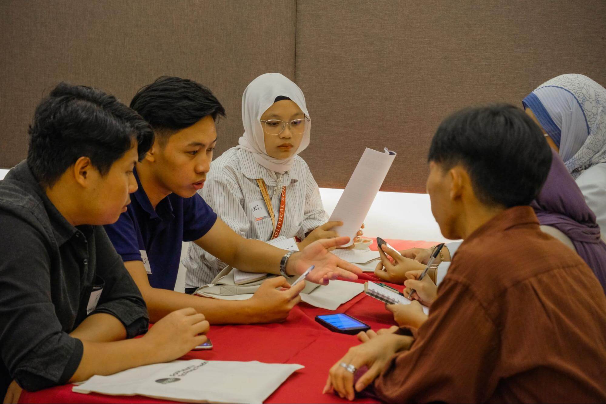 Student participants discussing Economic Charter-Change during a breakout session.